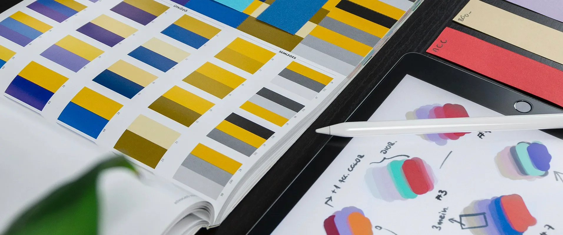 color swatches and ipad with Apple pencil on a desk